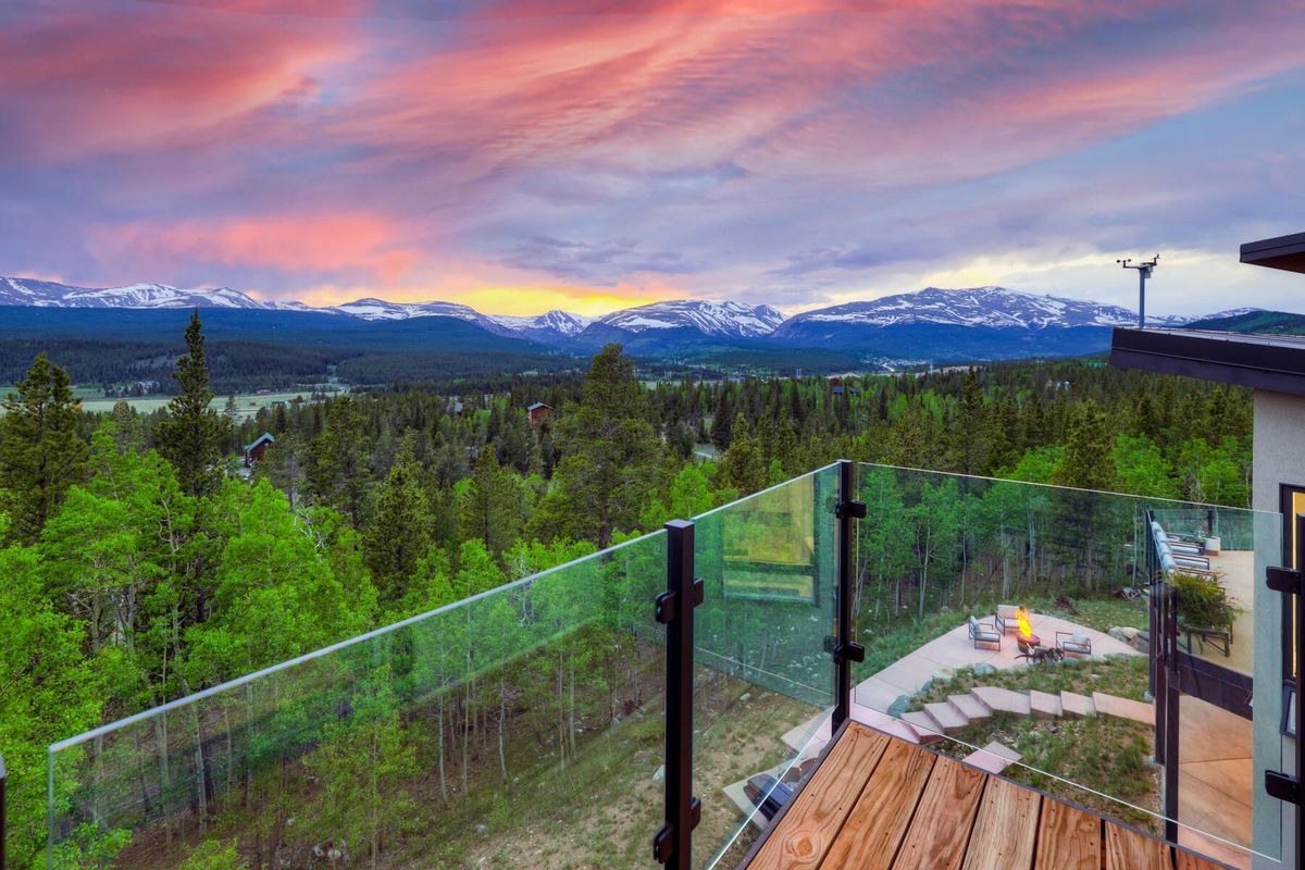 A luxury mountain home at dusk in Summit County, Colorado.