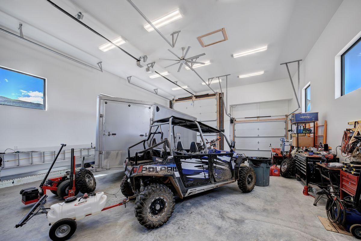 Heated and insulated shop with a pull-through RV bay
