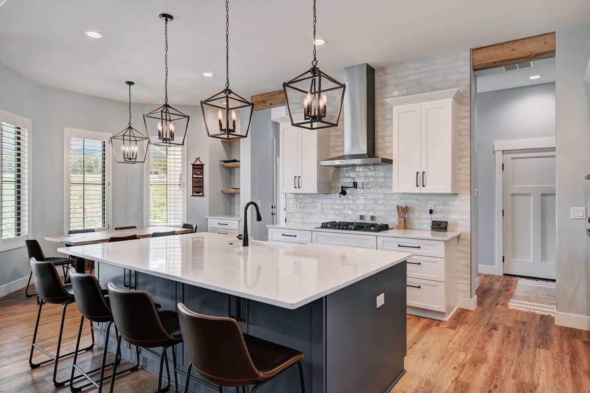 Chef's kitchen with a quartz island and Bosch appliances