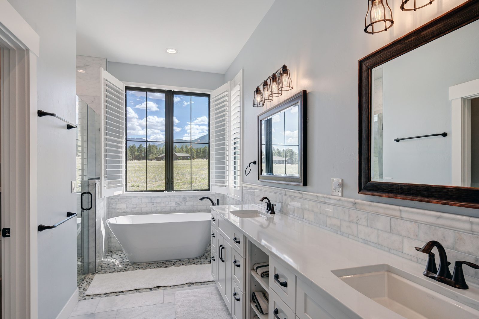 Primary bath with a soaking tub and Collegiate Peaks views